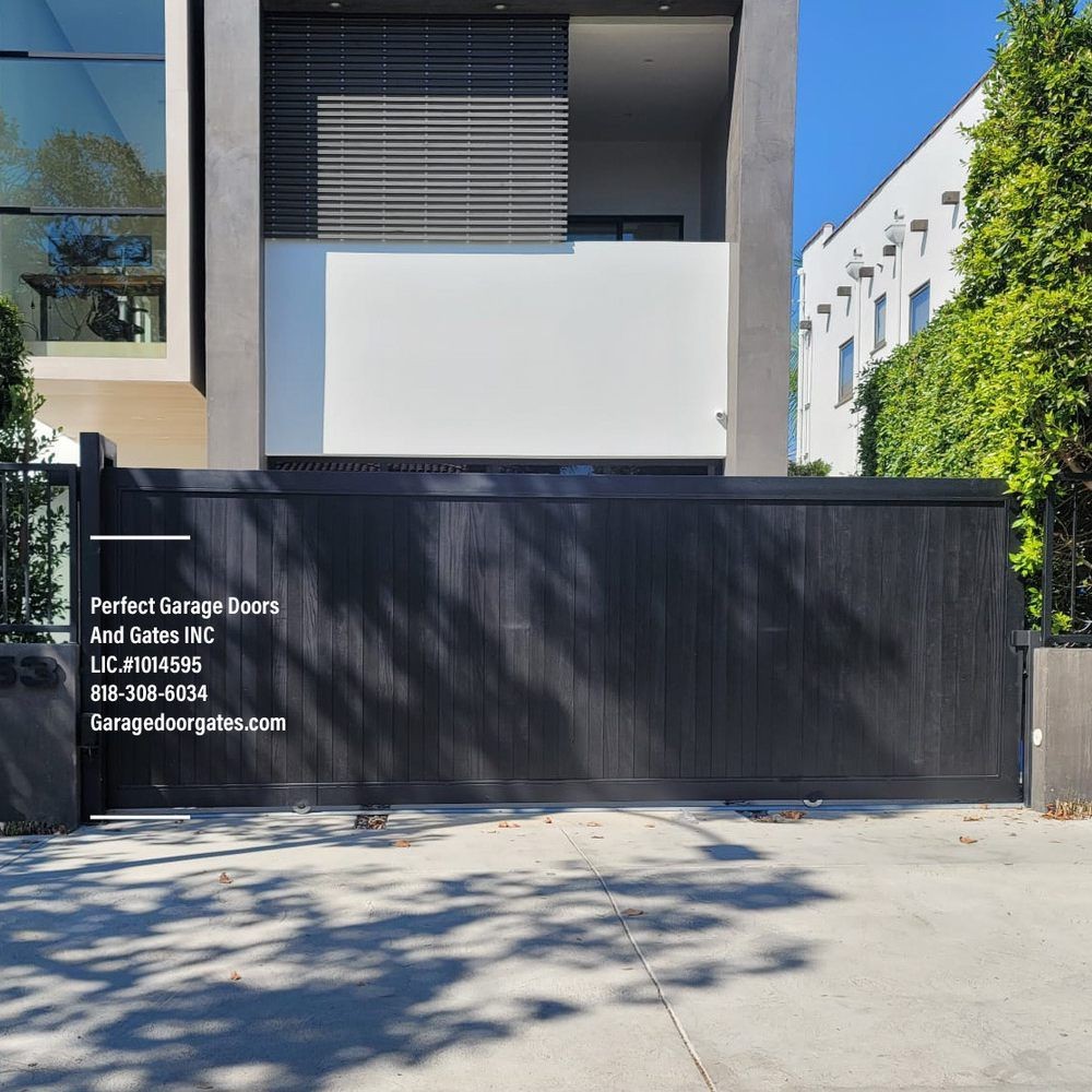 Custom Painted Vertical Wood Sliding Driveway Gate with Iron Frame