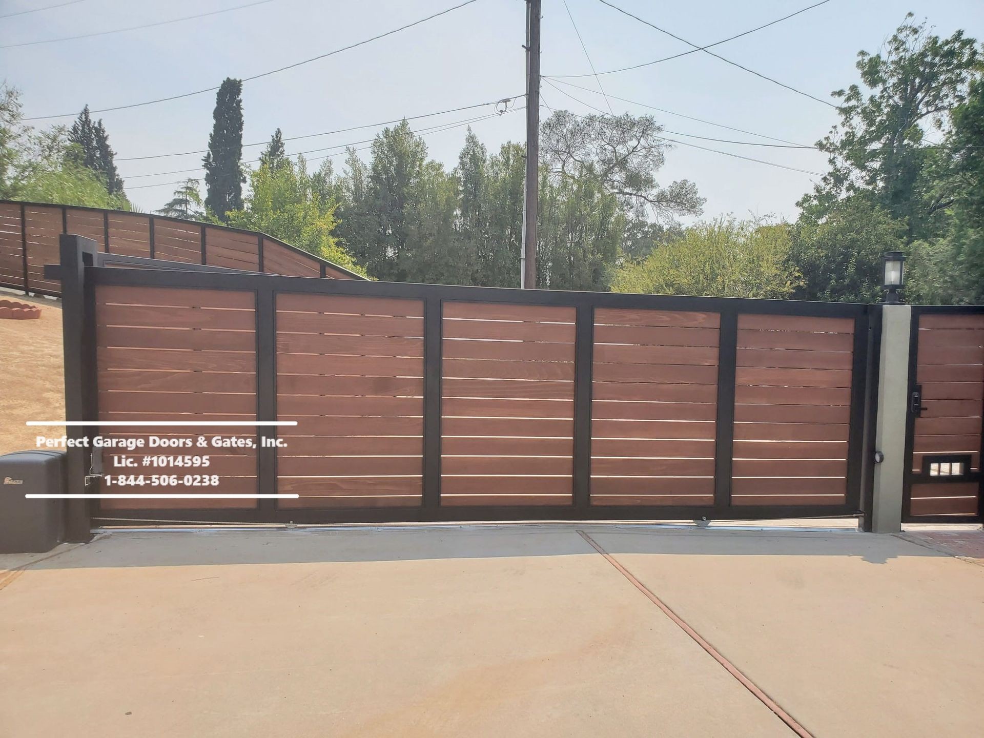 Custom Stained Horizontal Wood Sliding Driveway Gate with Iron Frame