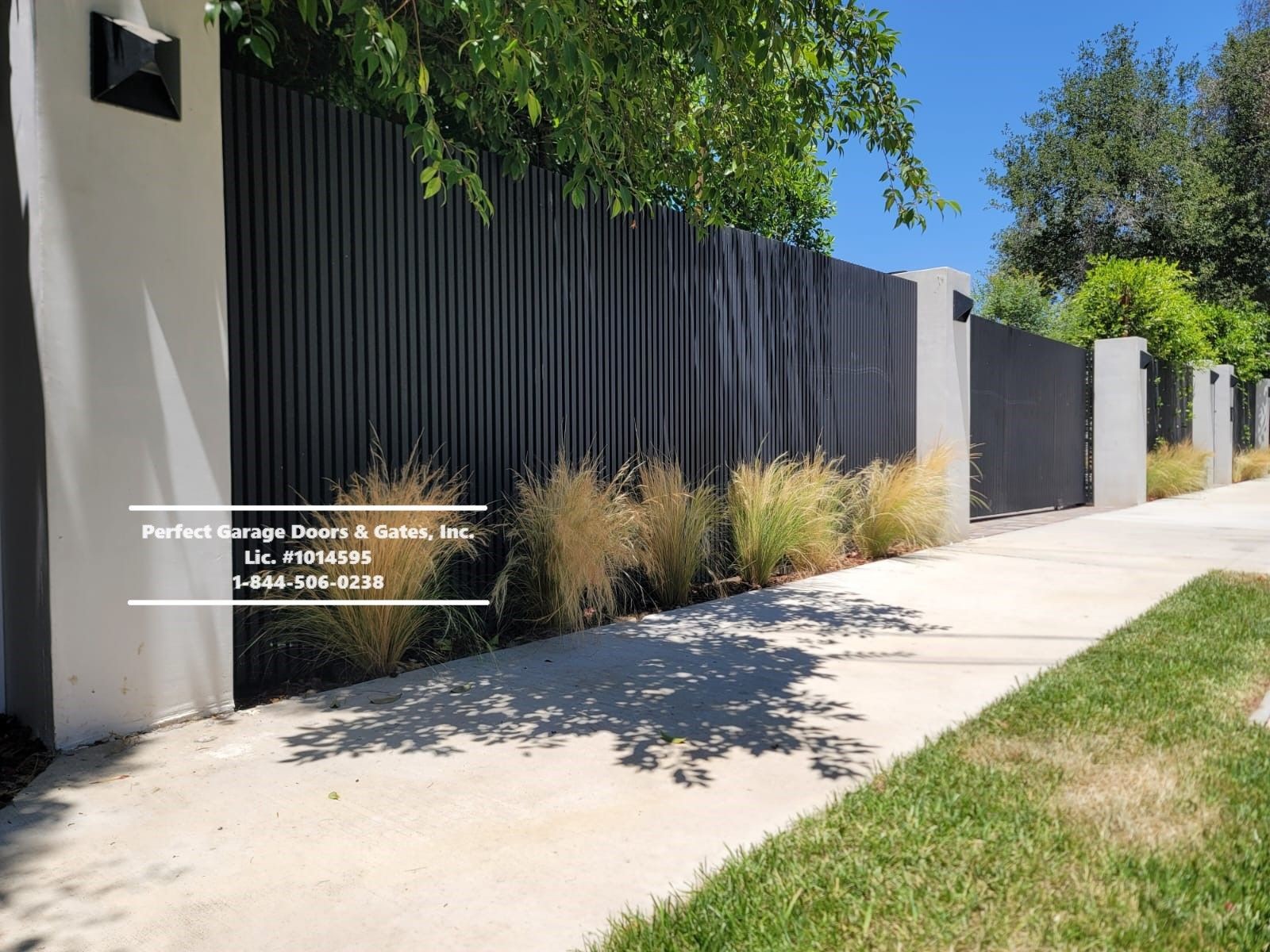 Custom Vertical Iron Fencing with Matching Driveway Gate