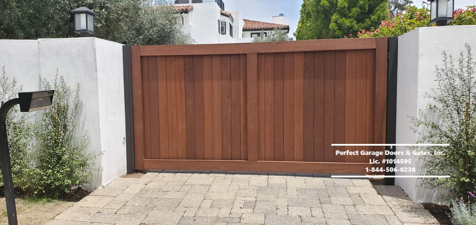 Custom Stained Vertical Wood Swing Driveway Gate with Wood Overlay Frame