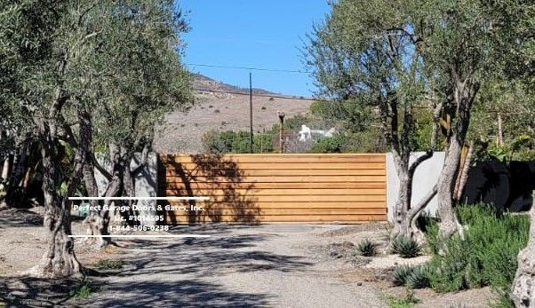 Custom Stained Horizontal Wood Sliding Driveway Gate