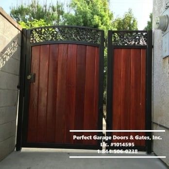 Custom Stained Vertical Wood Side Gate with Ornamental Iron and Framing