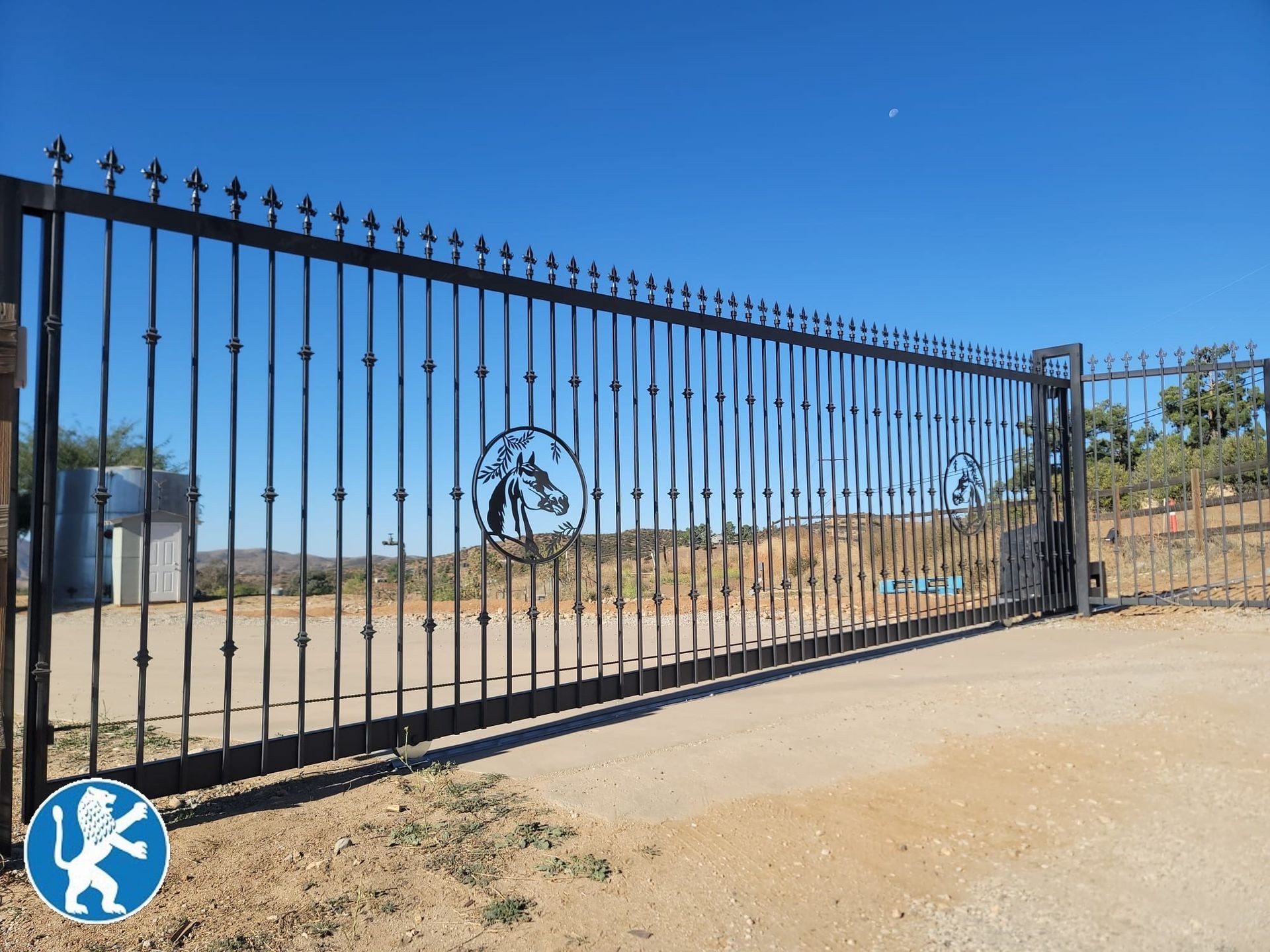 custom iron sliding gate with ornaments and spikes