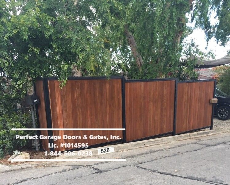 Custom Stained Vertical Wood Fence with Iron Frame