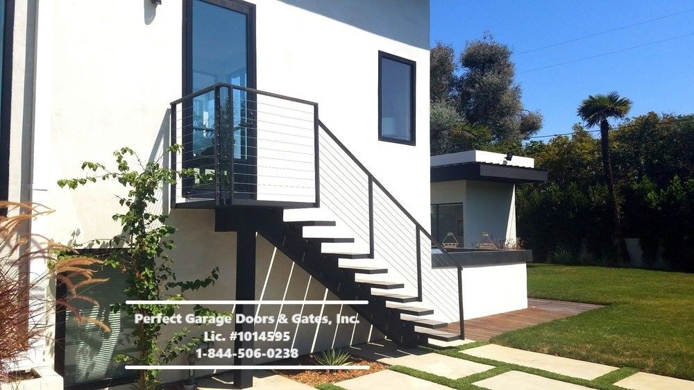 Custom Stainless Steel Cable Stair & Landing Railing with Iron Posts and Top Rail