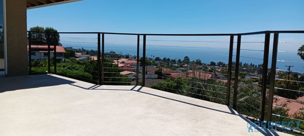 Custom Stainless Steel Cable Balcony Railing with Iron Posts and Top Rail