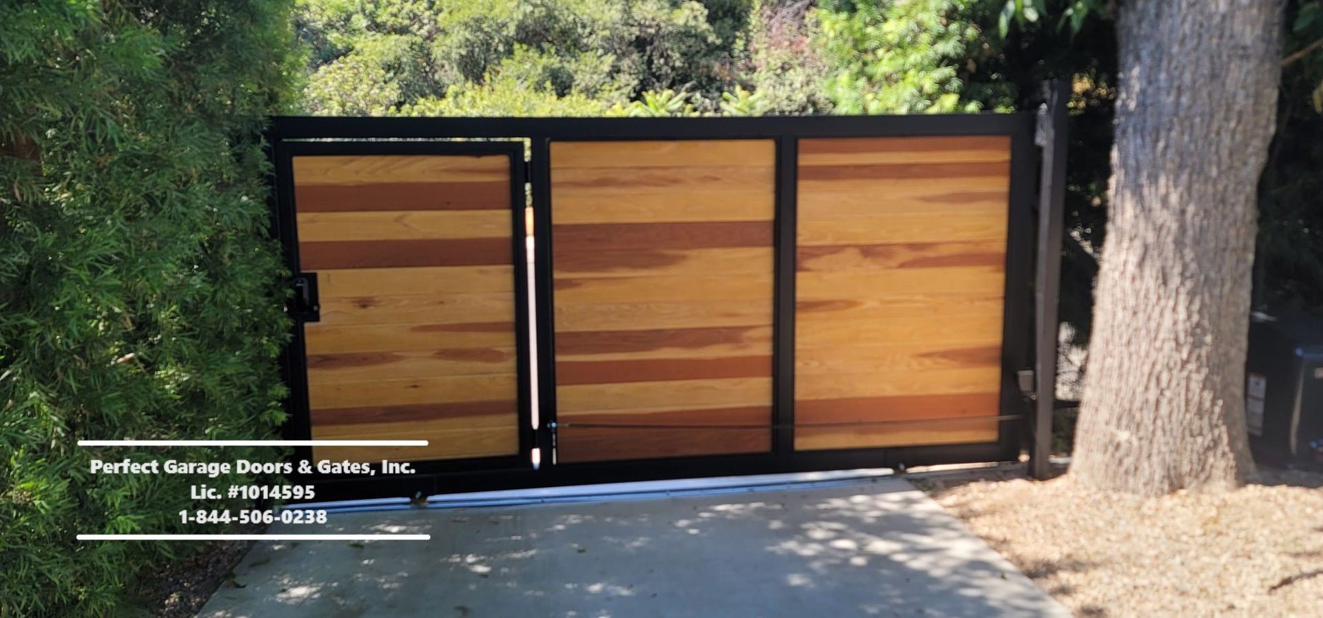 Custom Stained Horizontal Wood Sliding Driveway Gate with Iron Frame and Pedestrian Gate